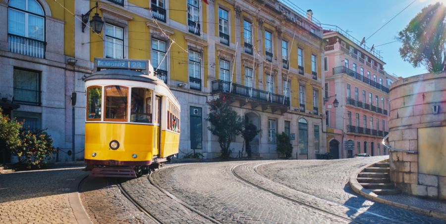 lisbon-tram-28-yellow-historic-alfama-cobblestone-street.jpg